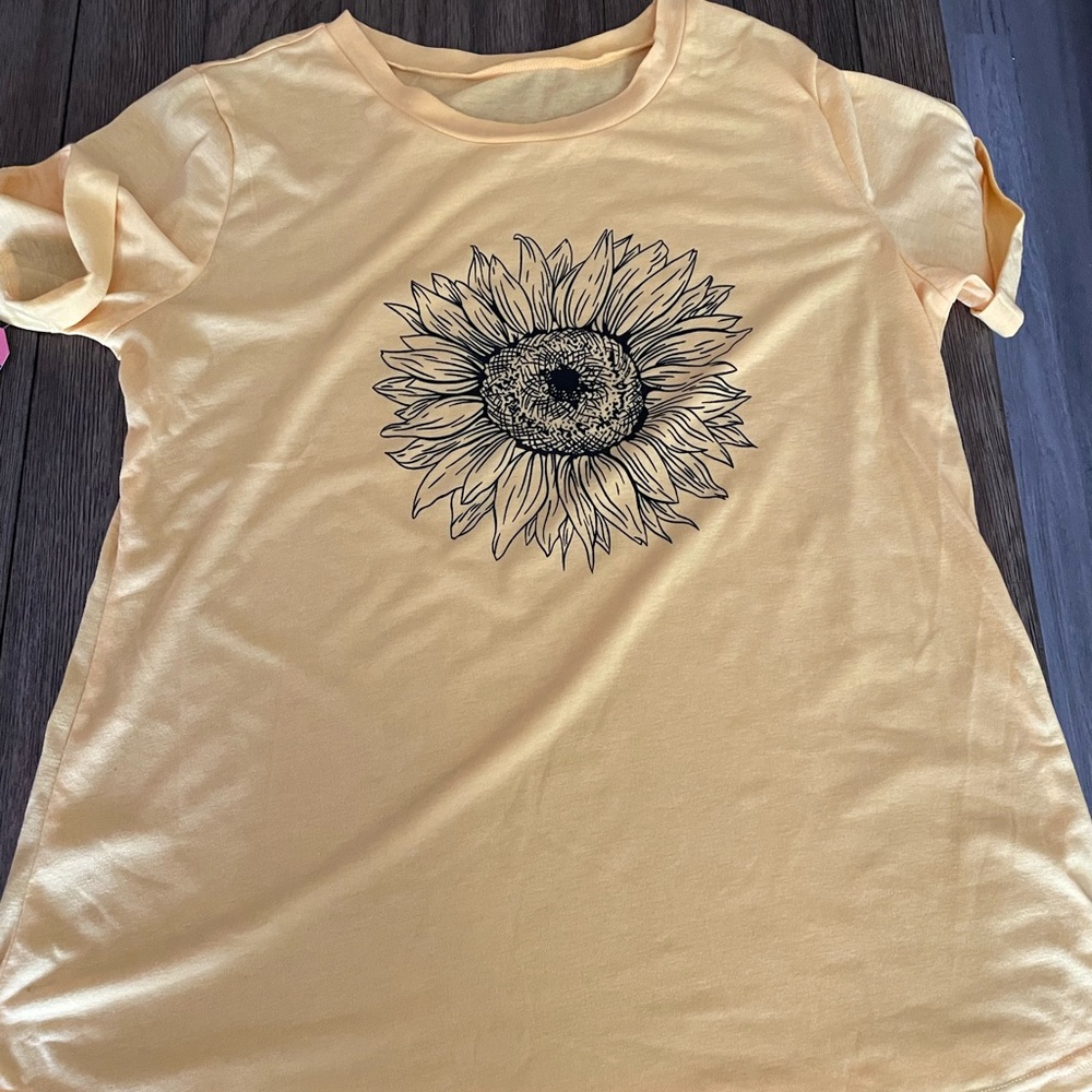Sunflower T. This shirt fits more like a large. Runs small
